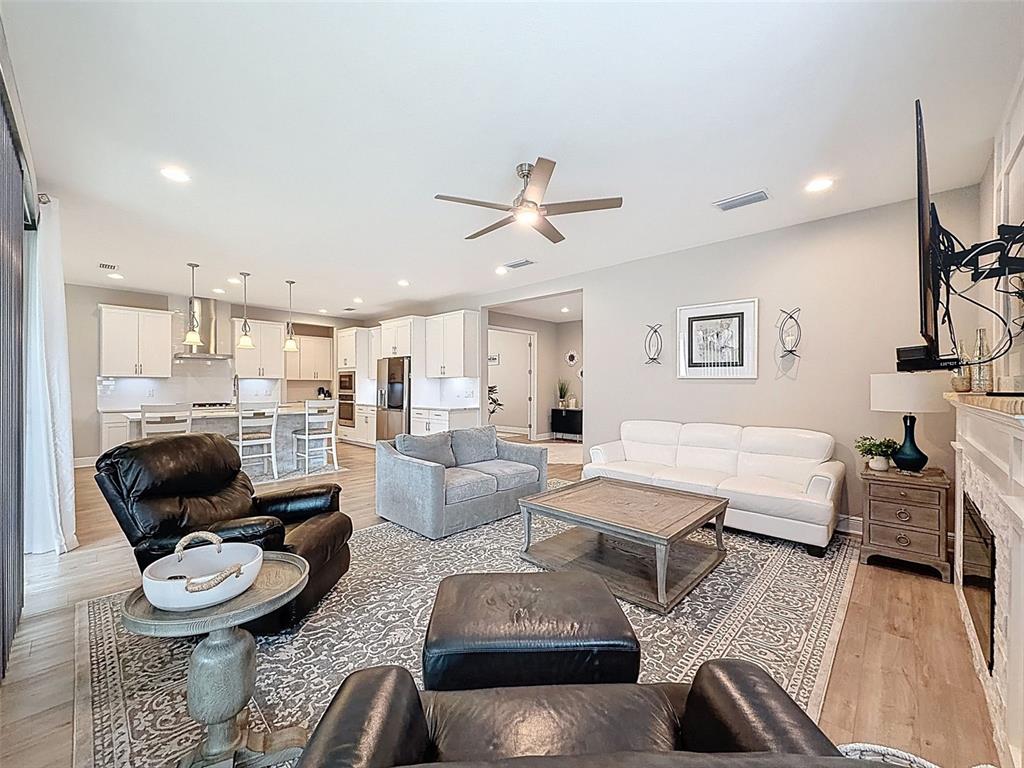 4312 Burdick Loop Odessa, FL 33556 - Photo 8 of 55 a living room with furniture and a view of kitchen