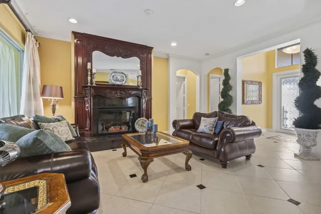 a living room with furniture a rug and a fireplace