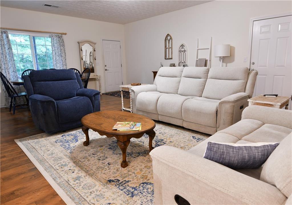 795 Sunset Ridge Lane Southeast Lawrenceville, GA 30045 - Photo 31 of 47 a living room with furniture and a window