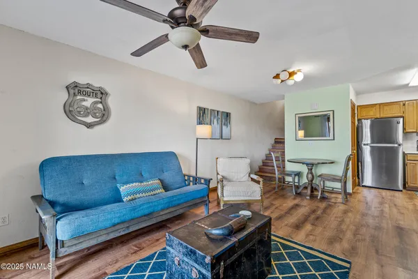 a kitchen with stainless steel appliances granite countertop a refrigerator stove microwave and sink