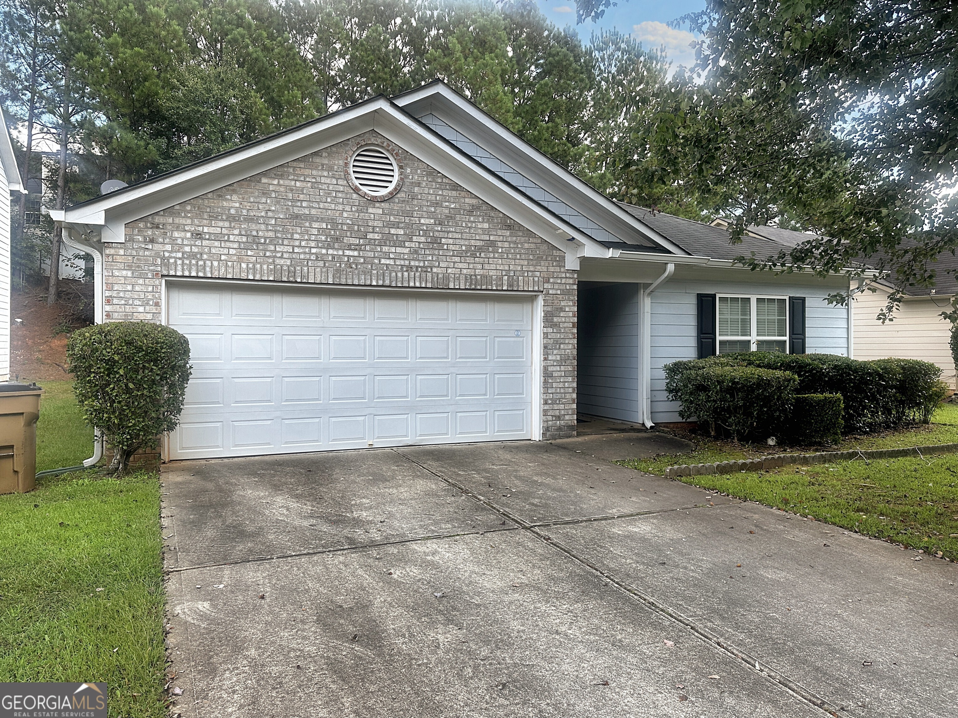 195 Creek Way Covington, GA 30016 - Photo 1 of 1 a front view of a house with garden