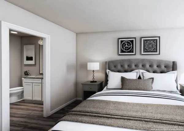 a bedroom with a bed and a view of bathroom