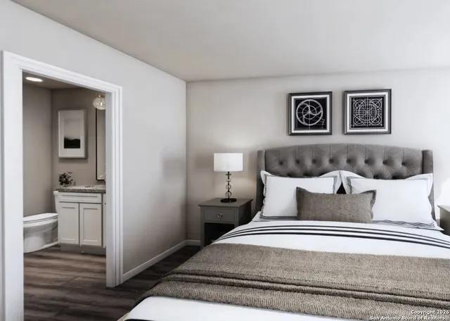 a bedroom with a bed and a view of bathroom