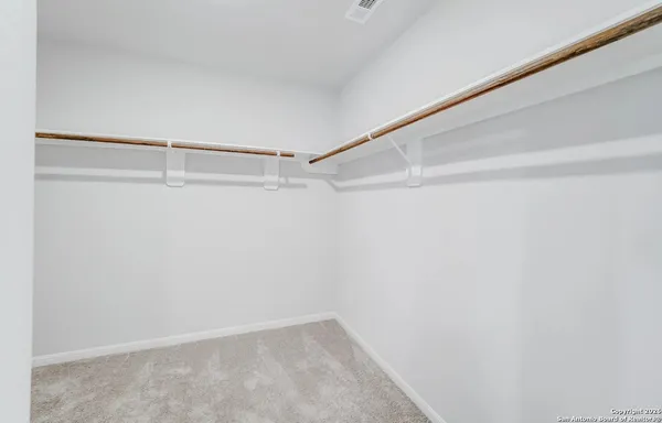 a view of an empty walk in closet