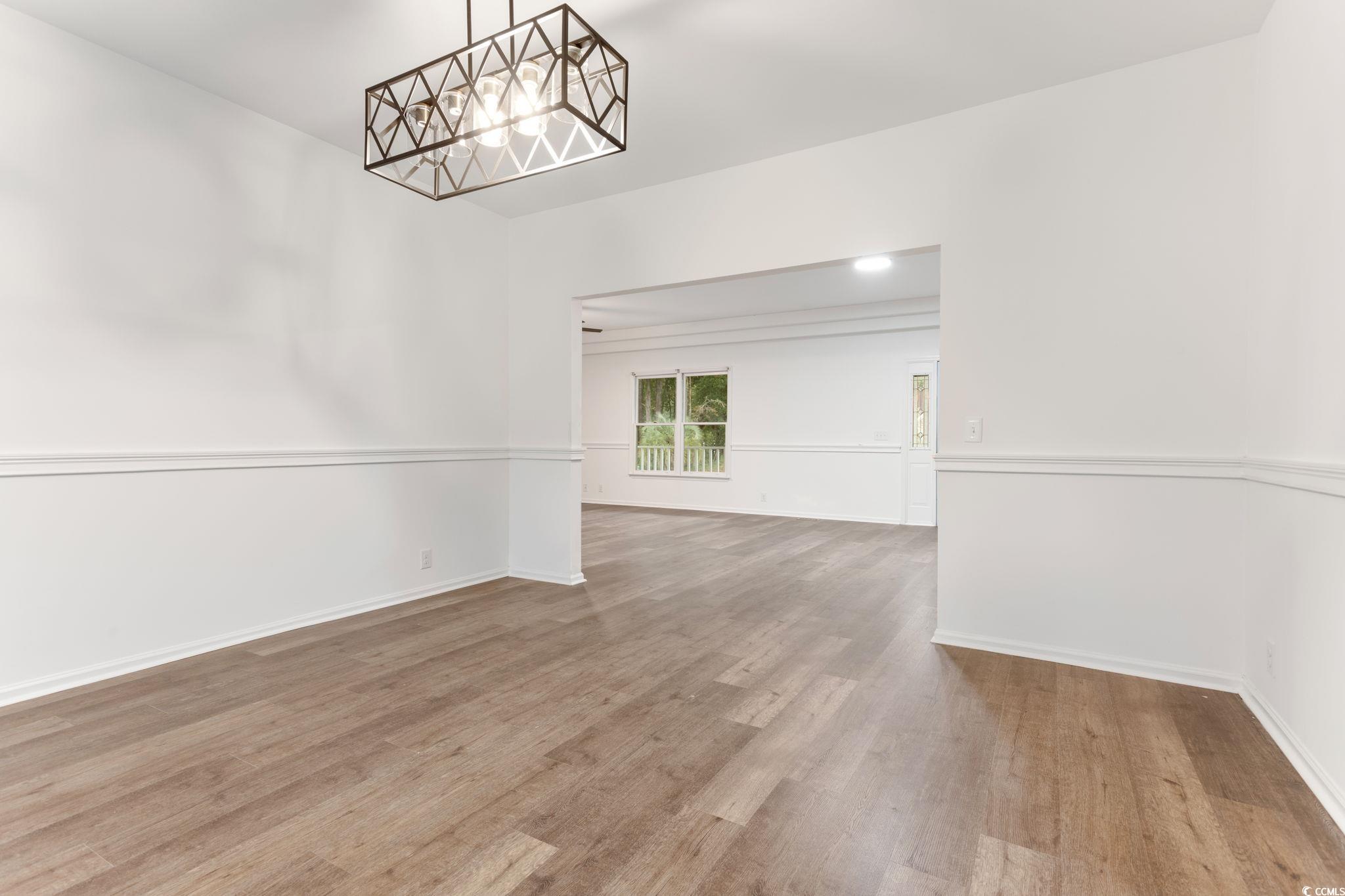 2321 Brick Drive Longs, SC 29568 - Photo 10 of 40 Empty room featuring light wood finished floors and baseboards