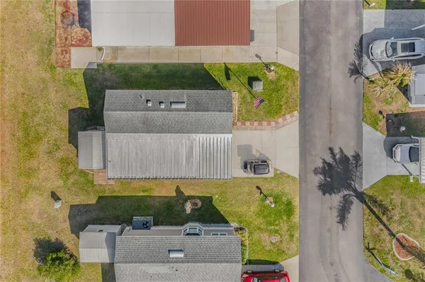 an aerial view of a house having yard