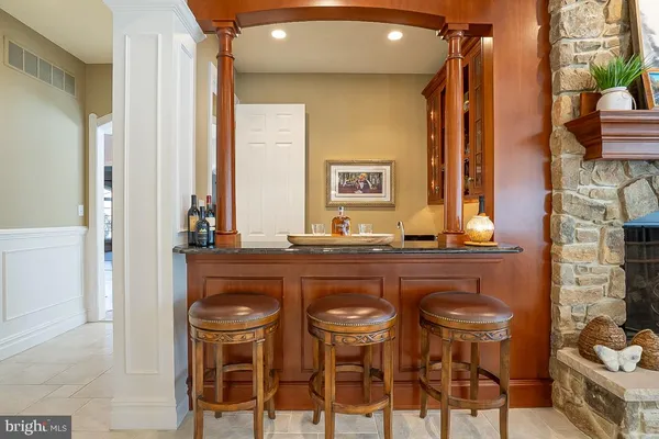 a view of a hallway with entryway and stairs
