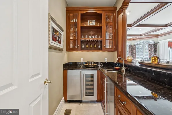 a bathroom with a toilet a sink and a mirror