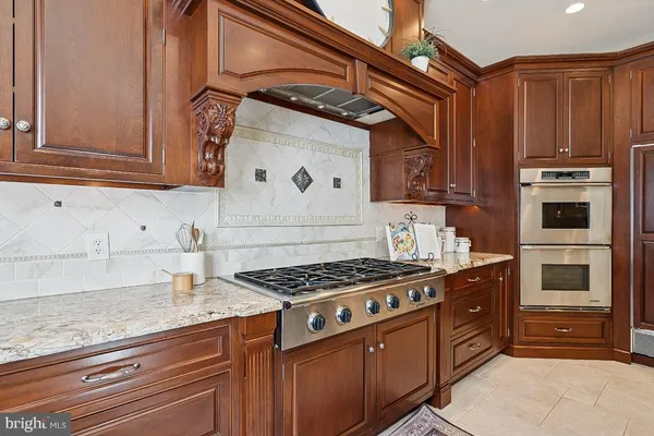a living room with furniture and a clock