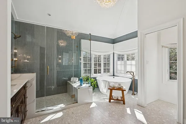 a spacious bedroom with a bed and cabinet