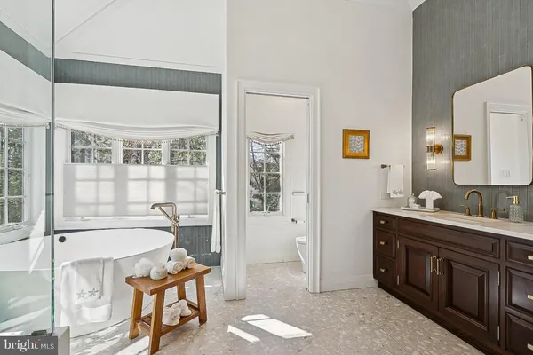 a utility room with cabinets washer and dryer