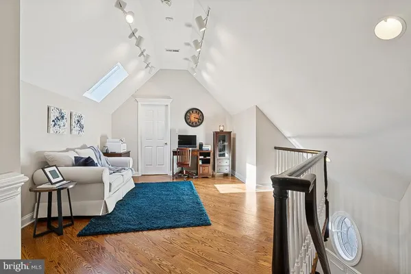 a room with gym equipment and large mirror
