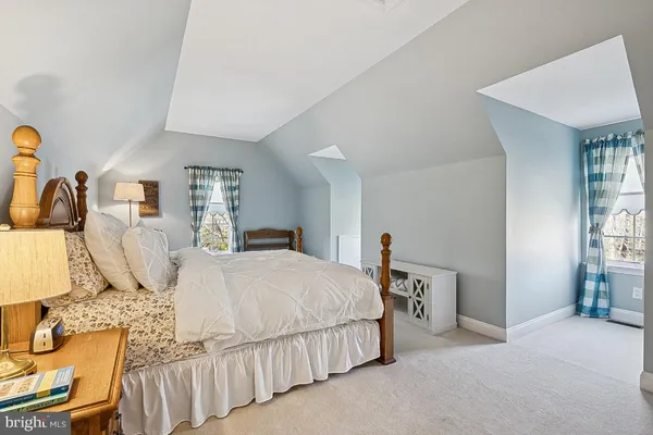a bathroom with a sink mirror and toilet