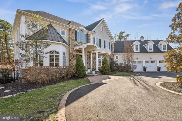 a view of an entryway with wooden floor and windows