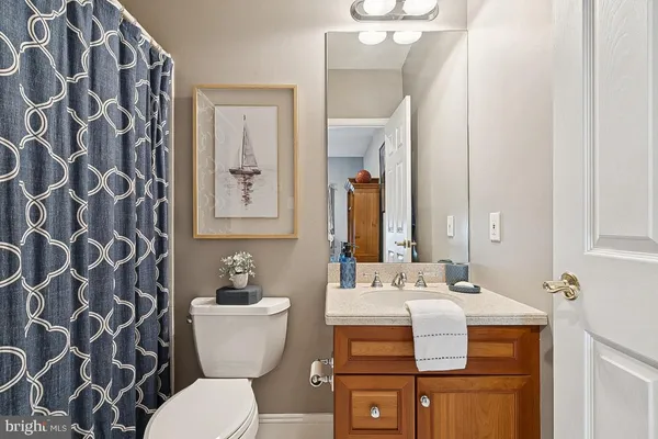 a body of water with a tree in the background