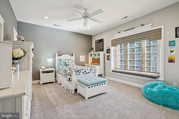 view of a city with lush green forest