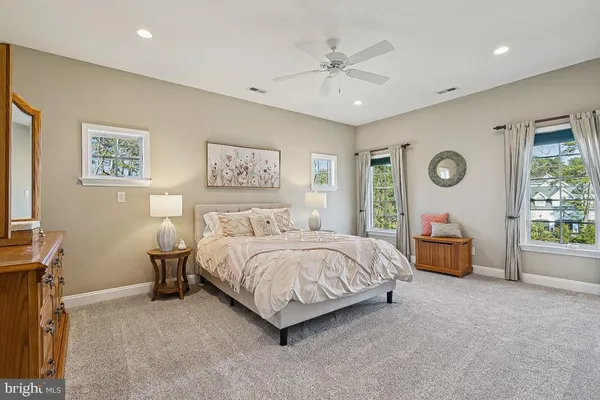 an aerial view of house with yard and mountain view in back