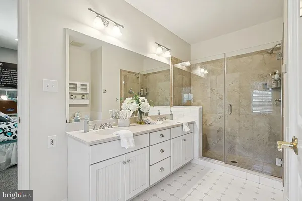 an aerial view of house with yard and mountain view in back