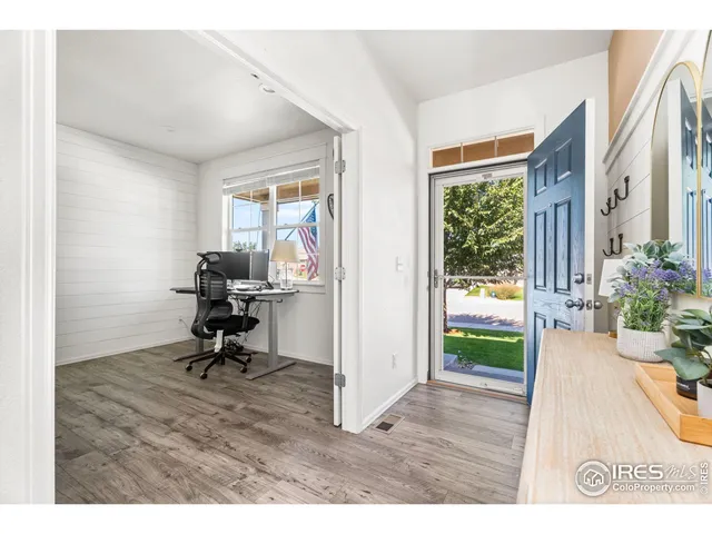 a view of a workspace and living room