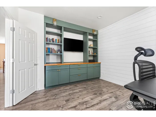 a room with furniture and flat screen tv