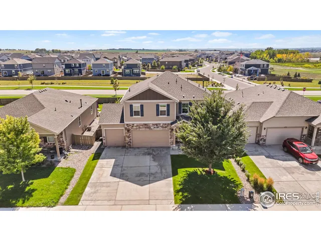 an aerial view of a house with a swimming pool yard and outdoor seating