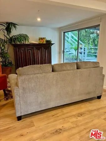 a living room with a couch and a large window
