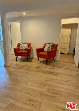 a room with furniture and a mirror