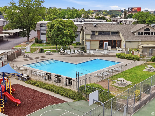 1700 Hickory Lane Provo, UT 84604 - Photo 4 of 20 Central swimming pool surrounded by a concrete deck with lounge seating