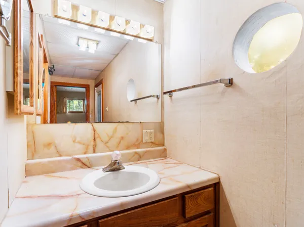 a kitchen with stainless steel appliances granite countertop a stove and a microwave