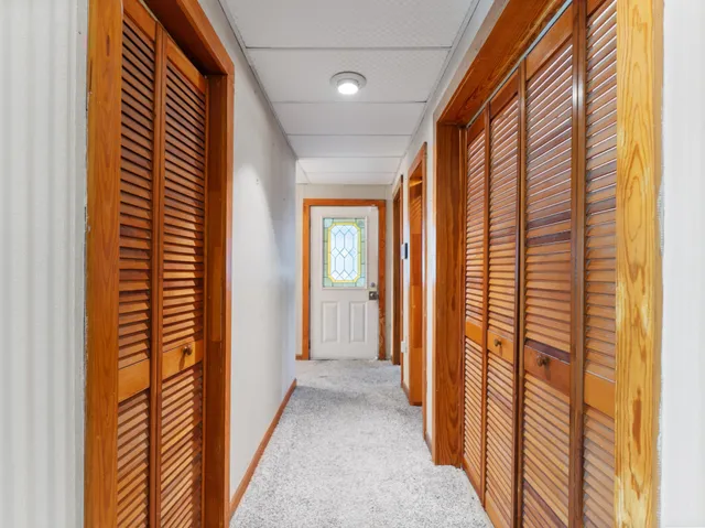 a view of a room with window and a ceiling fan