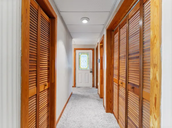 a view of balcony with wooden floor and fence