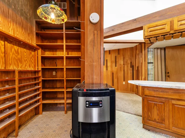 a view of balcony with wooden floor and fence