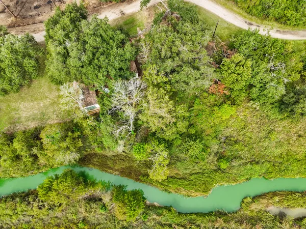 a front view of a house with wooden deck