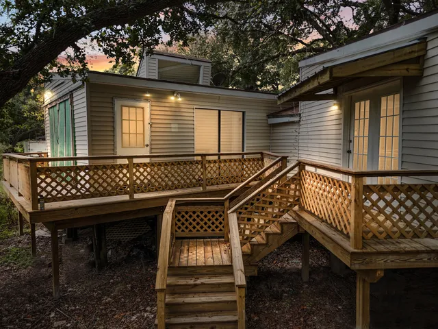 a view of a house with a yard and sitting area