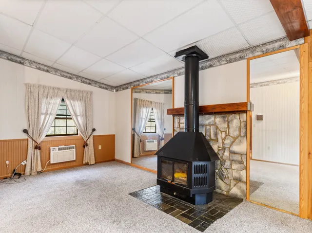 a kitchen with a sink a counter top space and stainless steel appliances