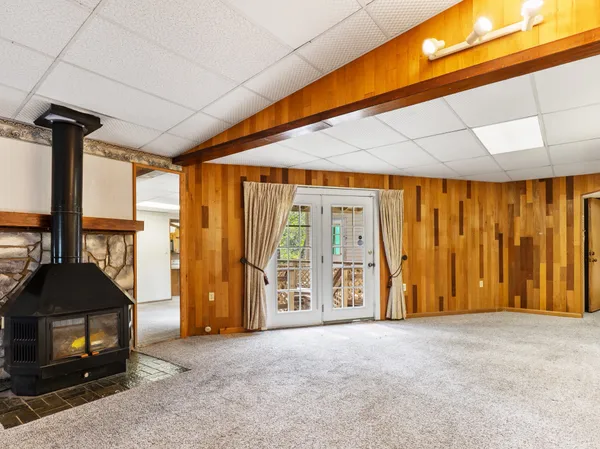 a view of a room with window and a ceiling fan