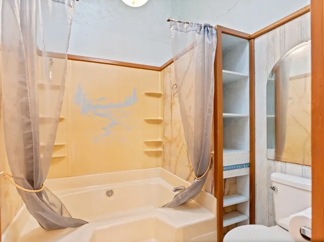 a view of a hallway with windows