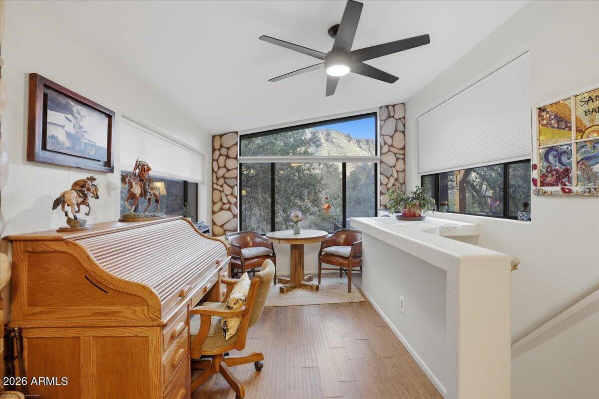 4426 North State Rte 89A, Unit 13 Sedona, AZ 86336 - Photo 24 of 47 a living room with furniture and a large window