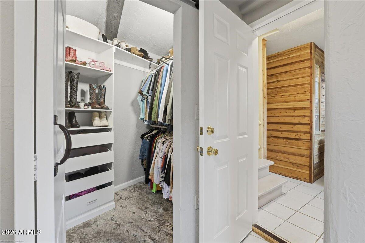 4426 North State Rte 89A, Unit 13 Sedona, AZ 86336 - Photo 37 of 47 a view of walk in closet with clothes and shoes