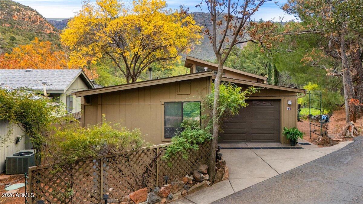 4426 North State Rte 89A, Unit 13 Sedona, AZ 86336 - Photo 6 of 47 a house with a tree in front of it