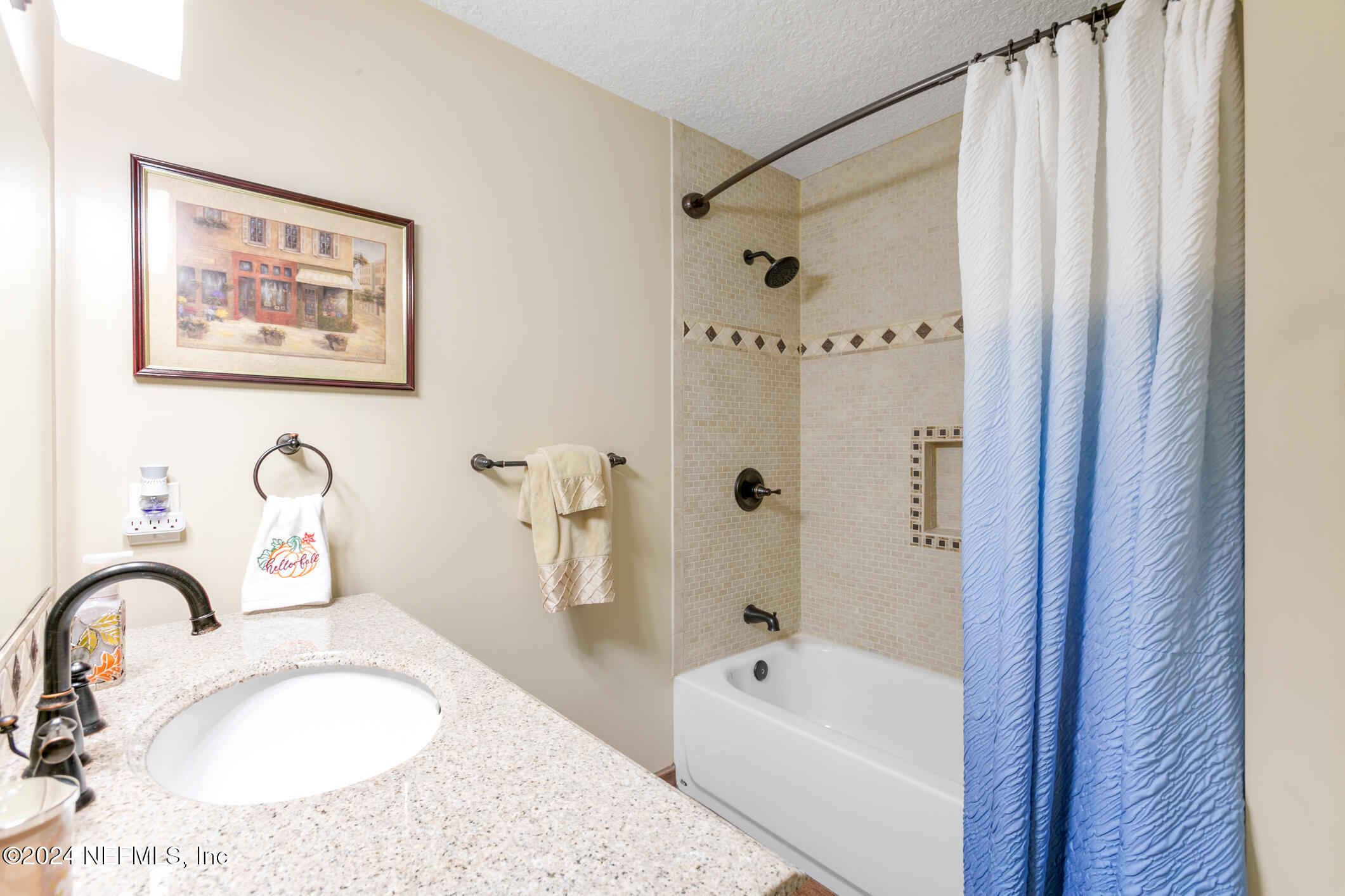 540 Moultrie Wells Road St. Augustine, FL 32086 - Photo 15 of 44 a bathroom with a tub sink and mirror