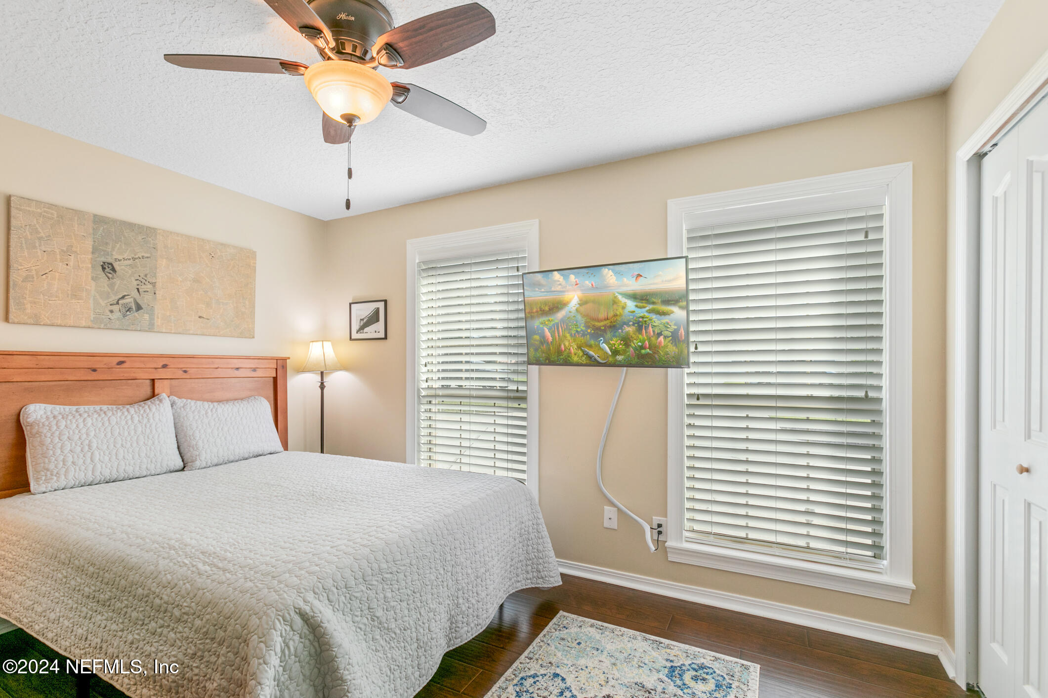 540 Moultrie Wells Road St. Augustine, FL 32086 - Photo 17 of 44 a bedroom with a large bed and a window