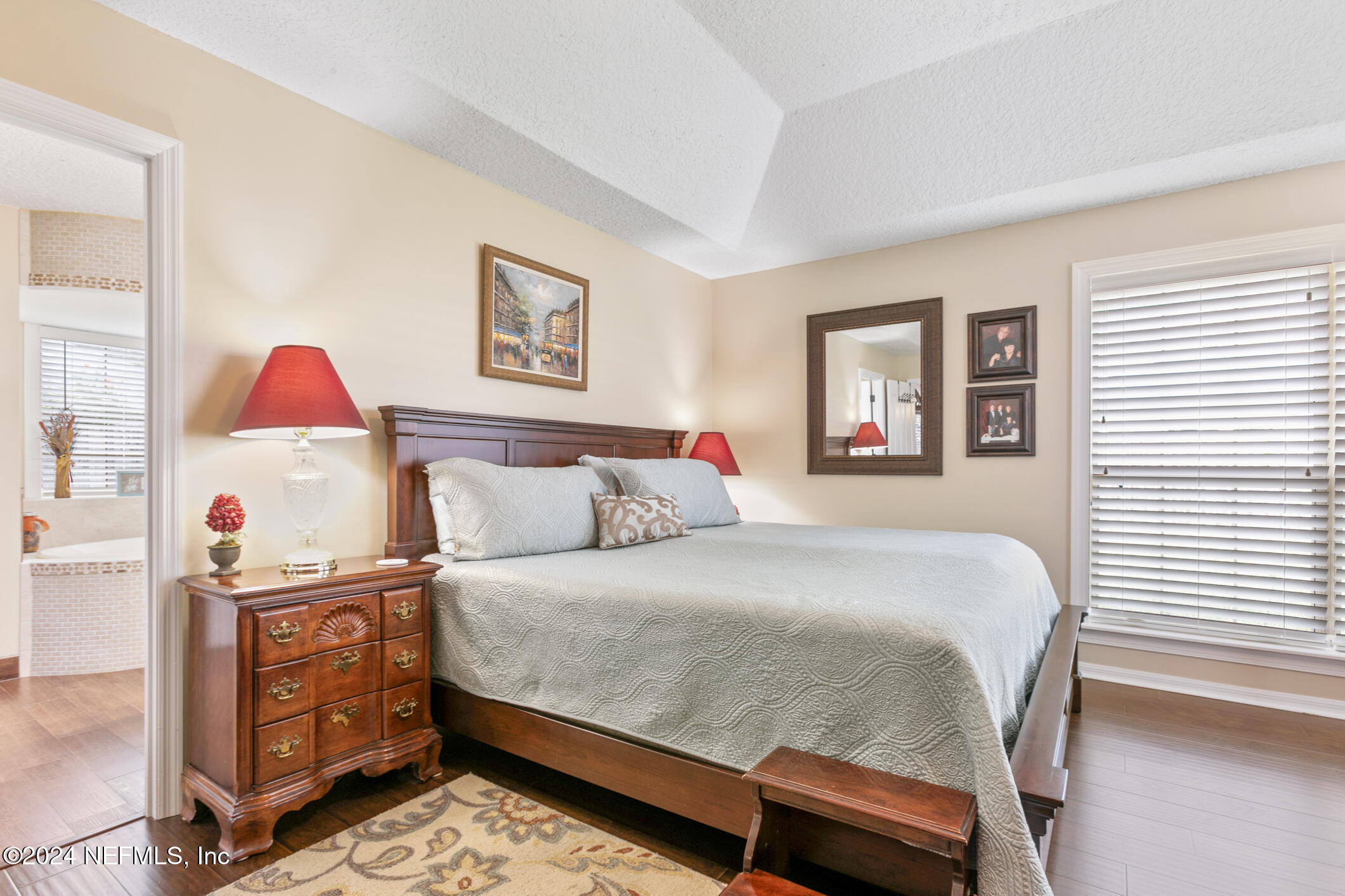 540 Moultrie Wells Road St. Augustine, FL 32086 - Photo 20 of 44 a bedroom with a bed and a cabinets