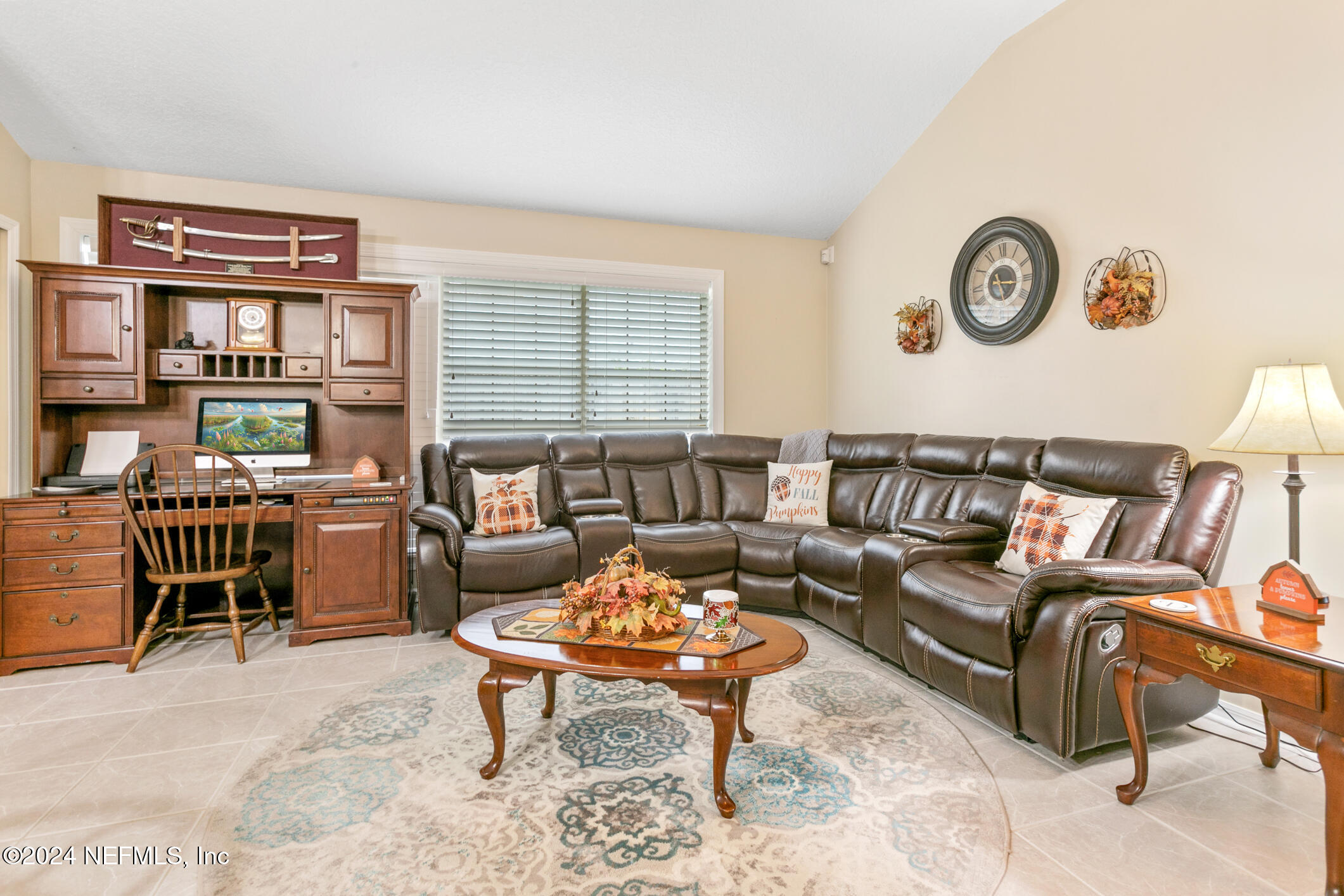 540 Moultrie Wells Road St. Augustine, FL 32086 - Photo 26 of 44 a living room with furniture a bookshelf and a window