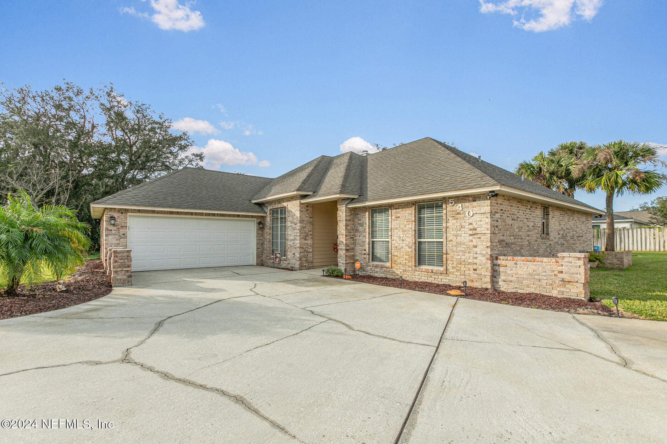 540 Moultrie Wells Road St. Augustine, FL 32086 - Photo 3 of 44 a view of a house with a yard and potted plants