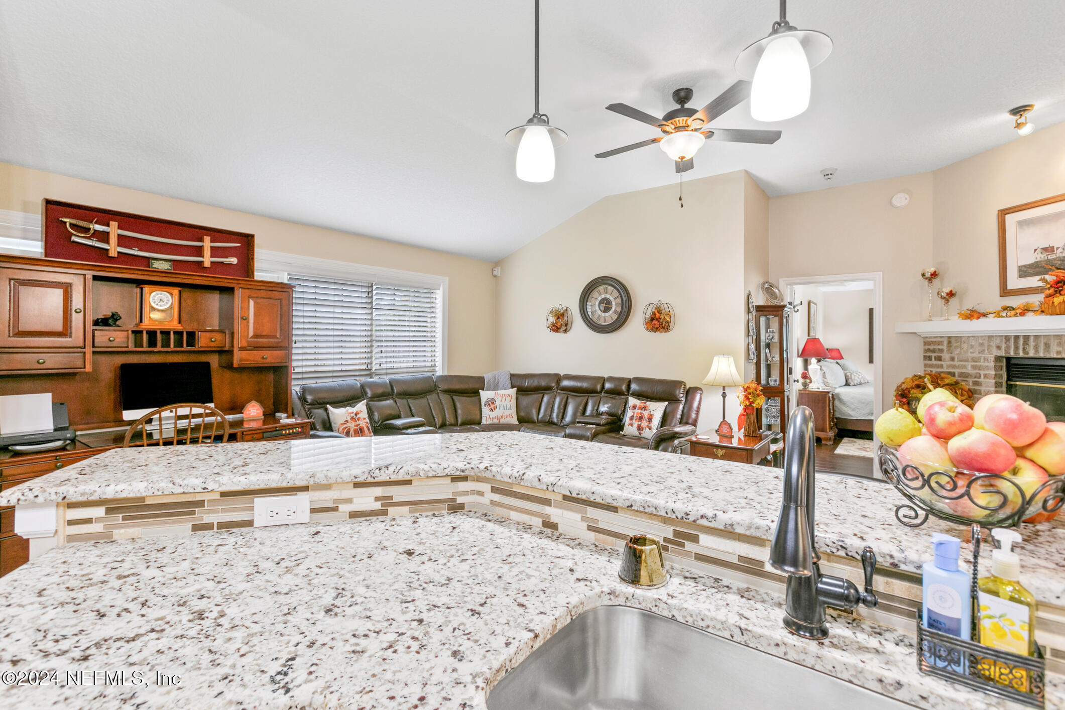 540 Moultrie Wells Road St. Augustine, FL 32086 - Photo 33 of 44 a view of a center kitchen and living room