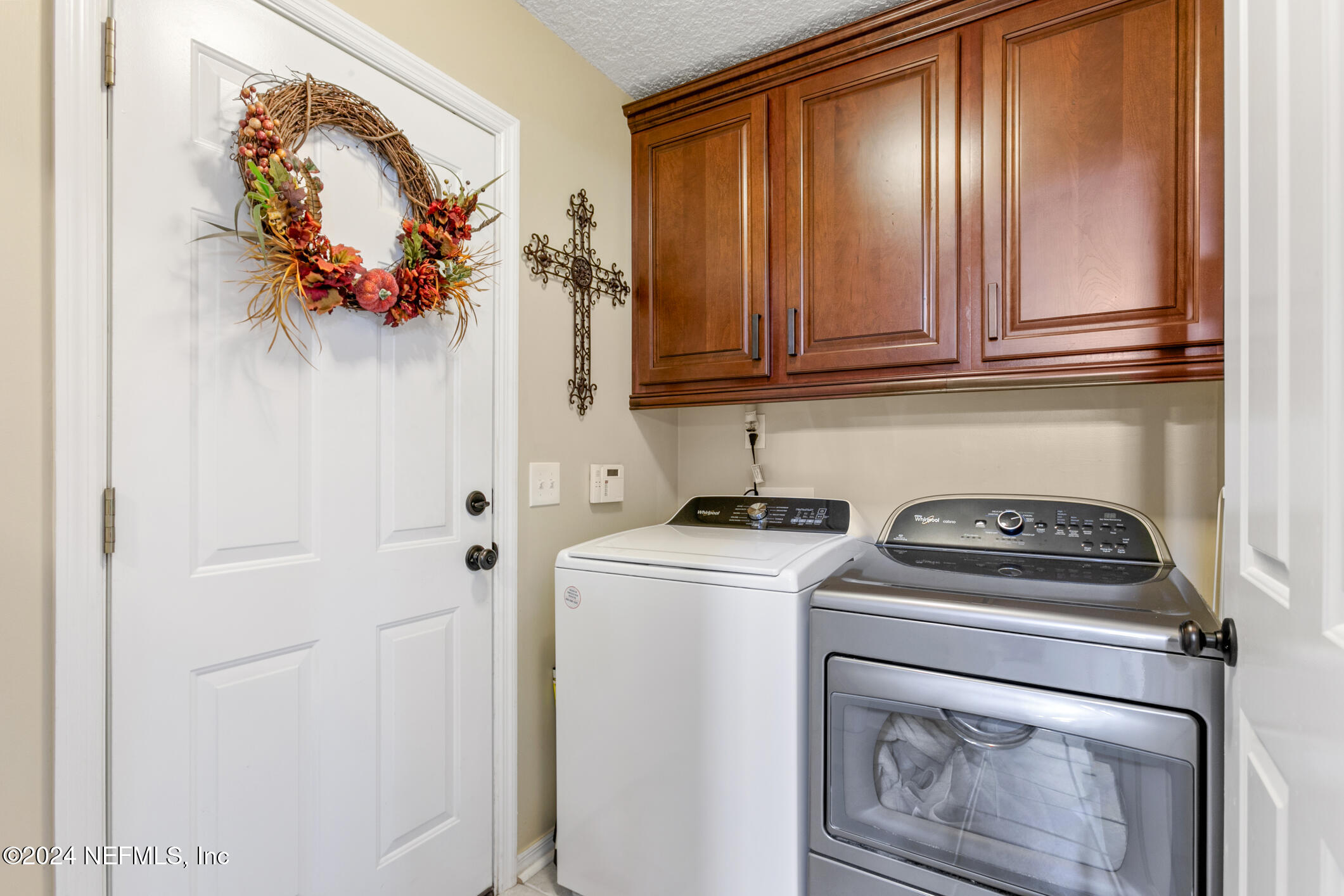 540 Moultrie Wells Road St. Augustine, FL 32086 - Photo 35 of 44 a utility room with dryer and washer