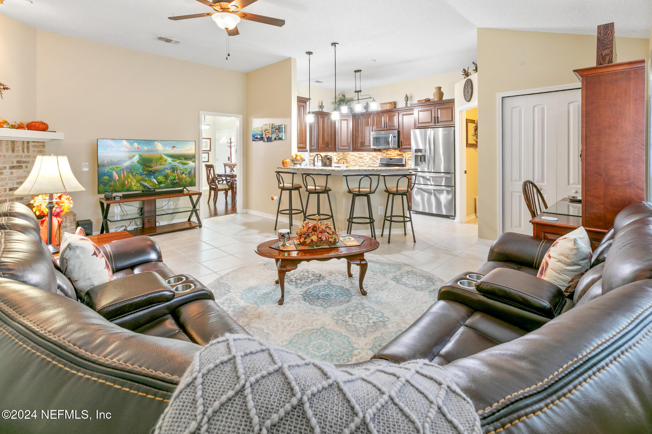540 Moultrie Wells Road St. Augustine, FL 32086 - Photo 36 of 44 a living room with furniture and a floor to ceiling window