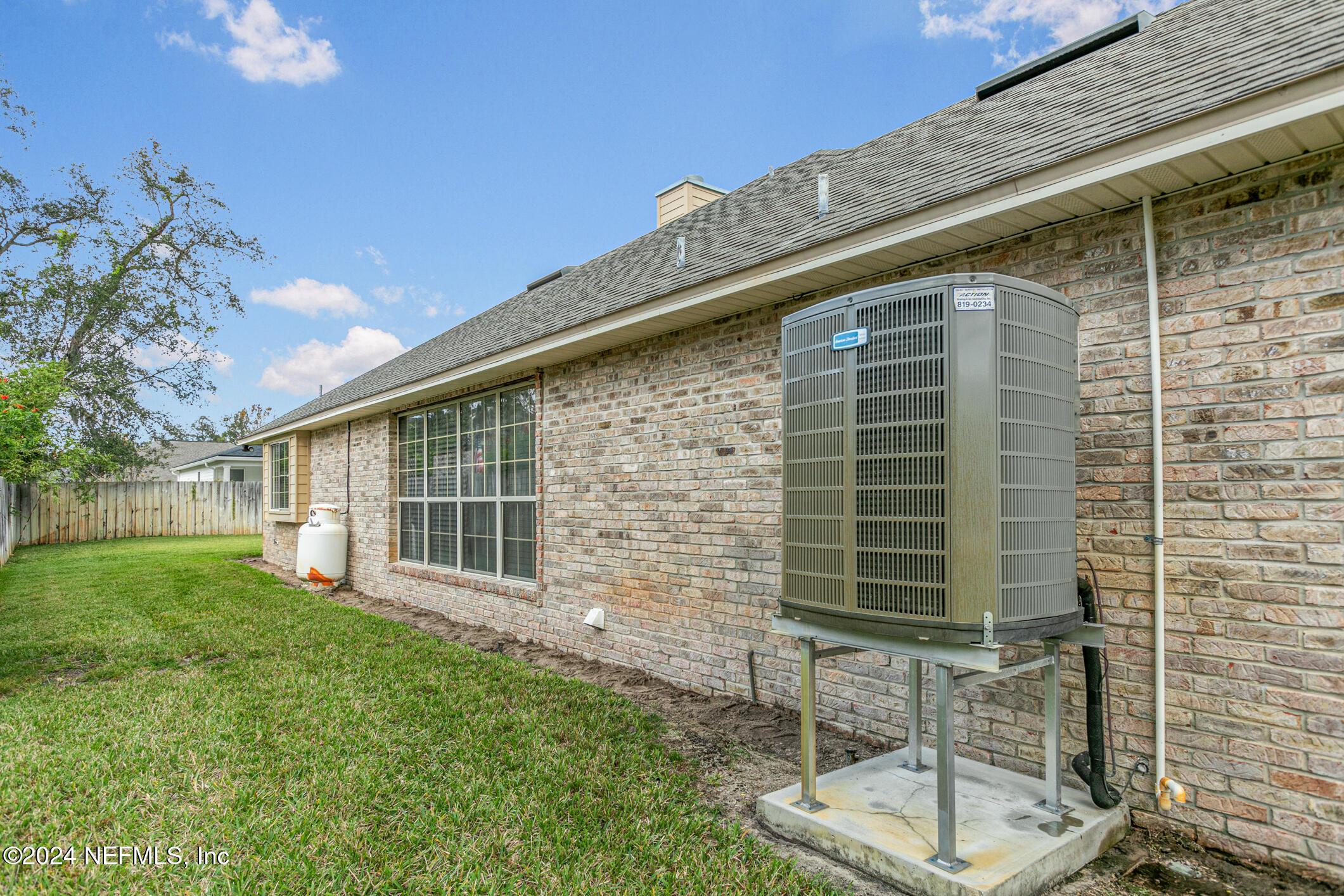 540 Moultrie Wells Road St. Augustine, FL 32086 - Photo 37 of 44 a front view of a house with garden