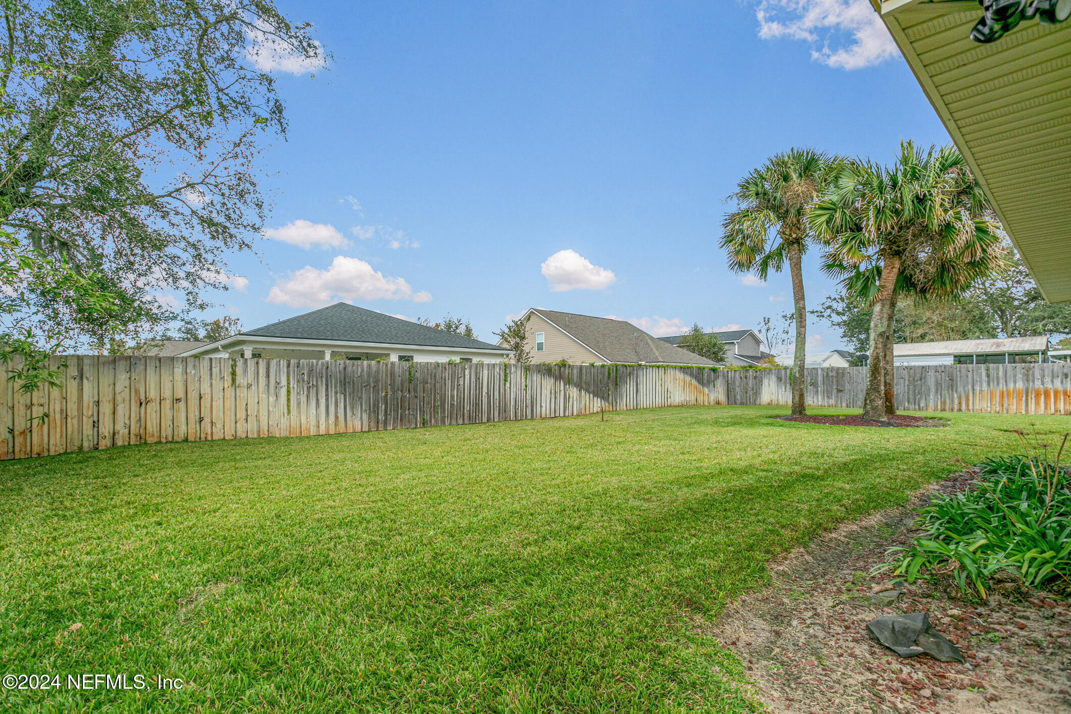 540 Moultrie Wells Road St. Augustine, FL 32086 - Photo 38 of 44 a view of a yard with a house